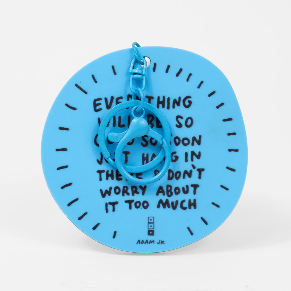Blue keychain with "EVERYTHING" quote by Adam JK on a white background