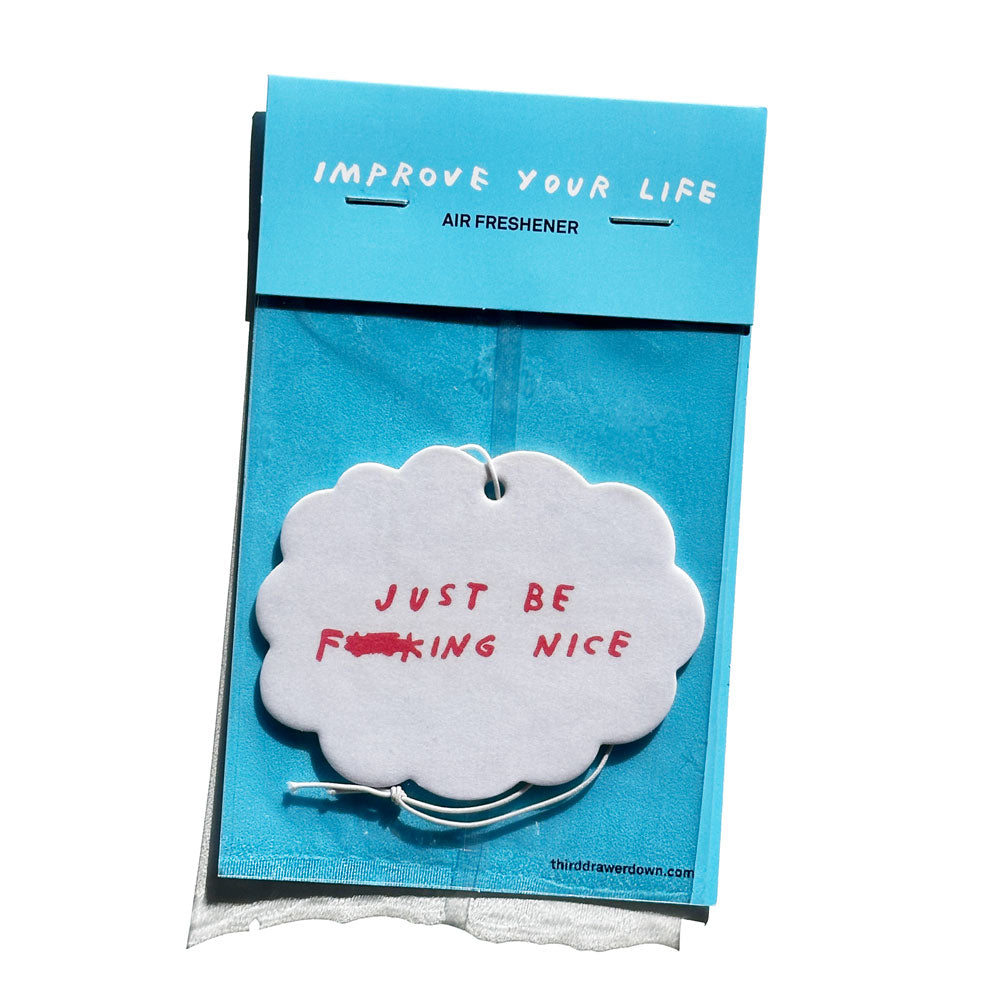 cloud shaped air freshener says "JUST BE F***ING NICE" in package