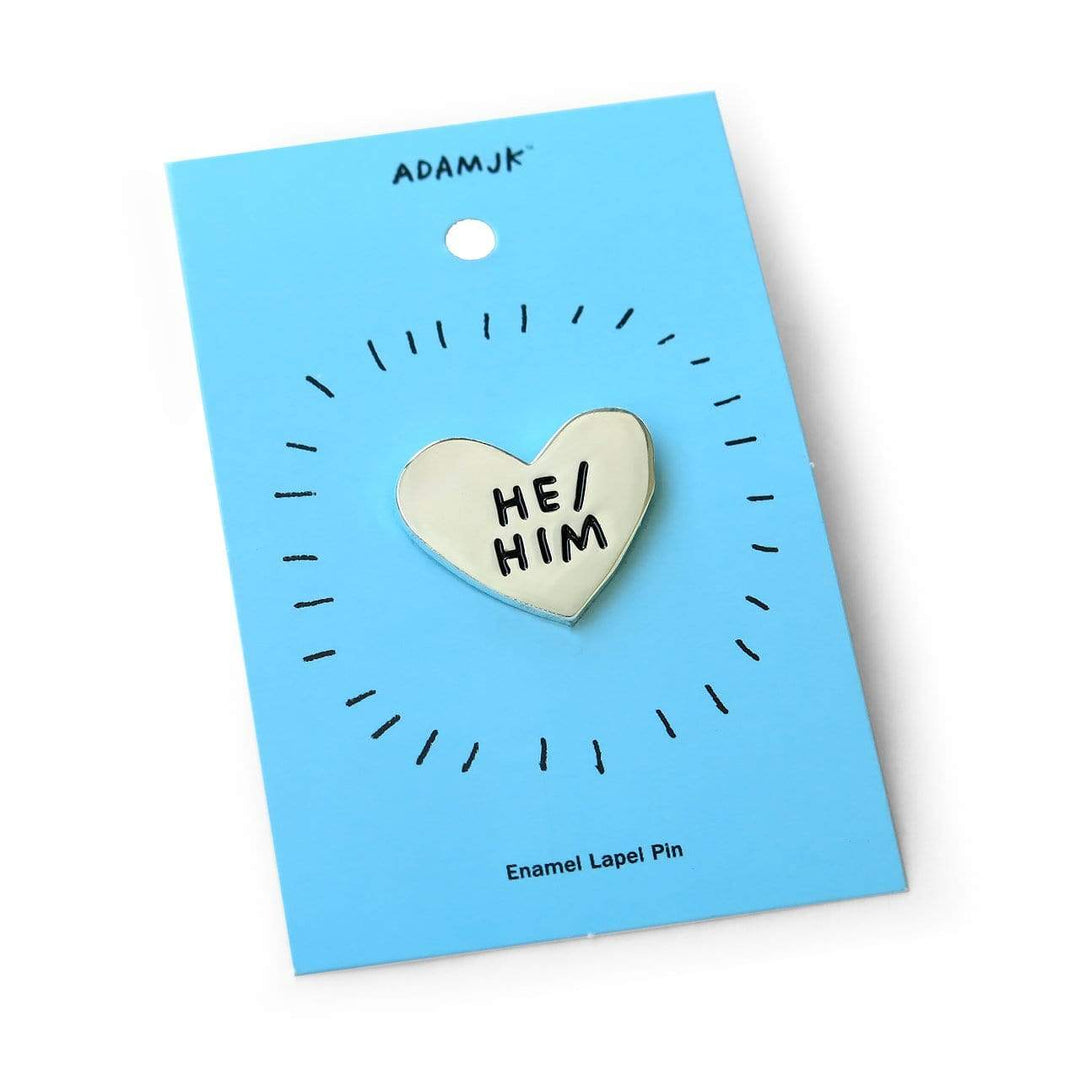 Pronoun Pins by Adam JK – Silver heart reads HE/HIM