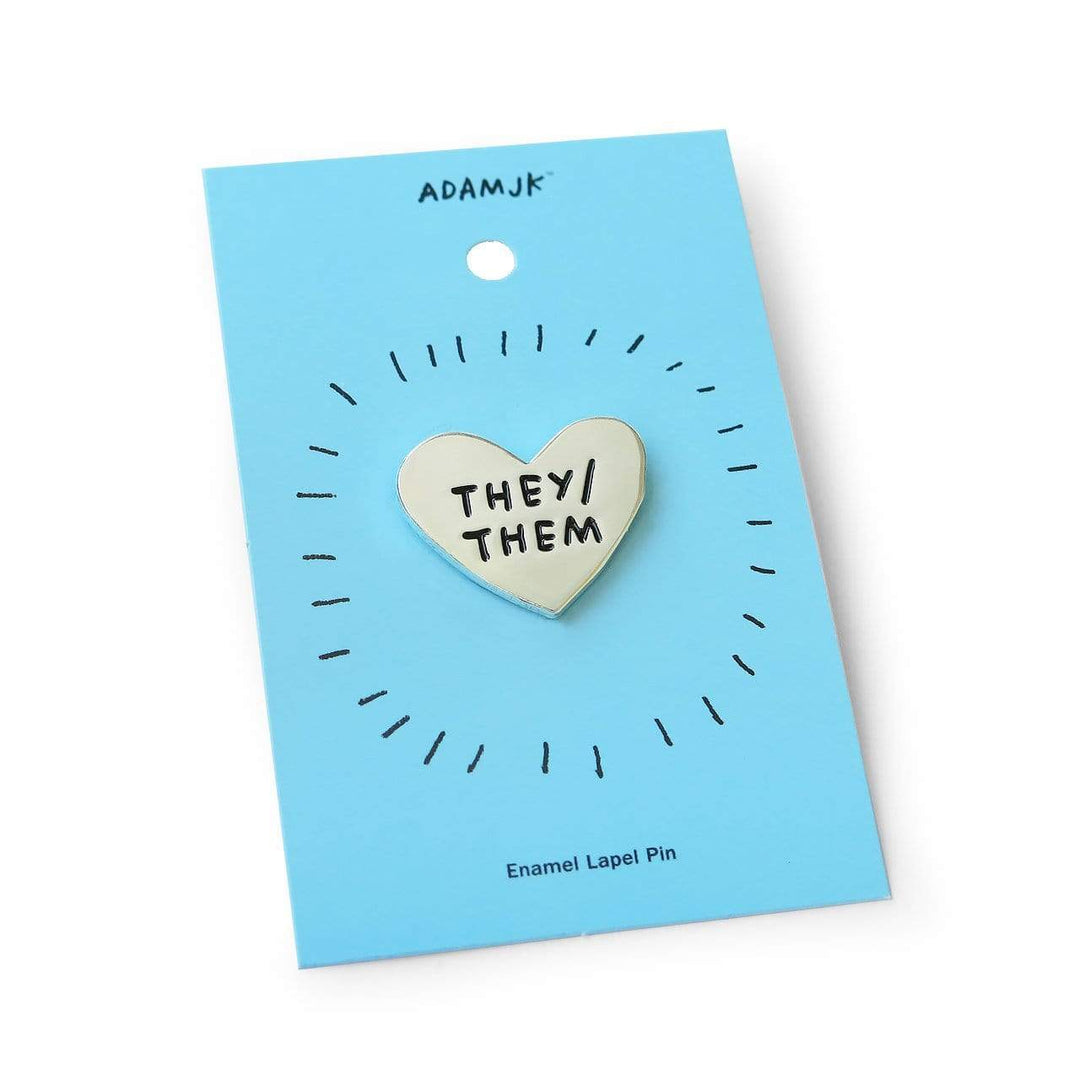 Pronoun Pins by Adam JK – Silver heart reads THEY/THEM